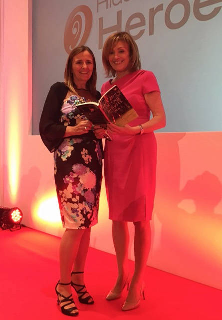 Linda Allen with Mary Kennedy holding the book at the Hidden Heroes Awards